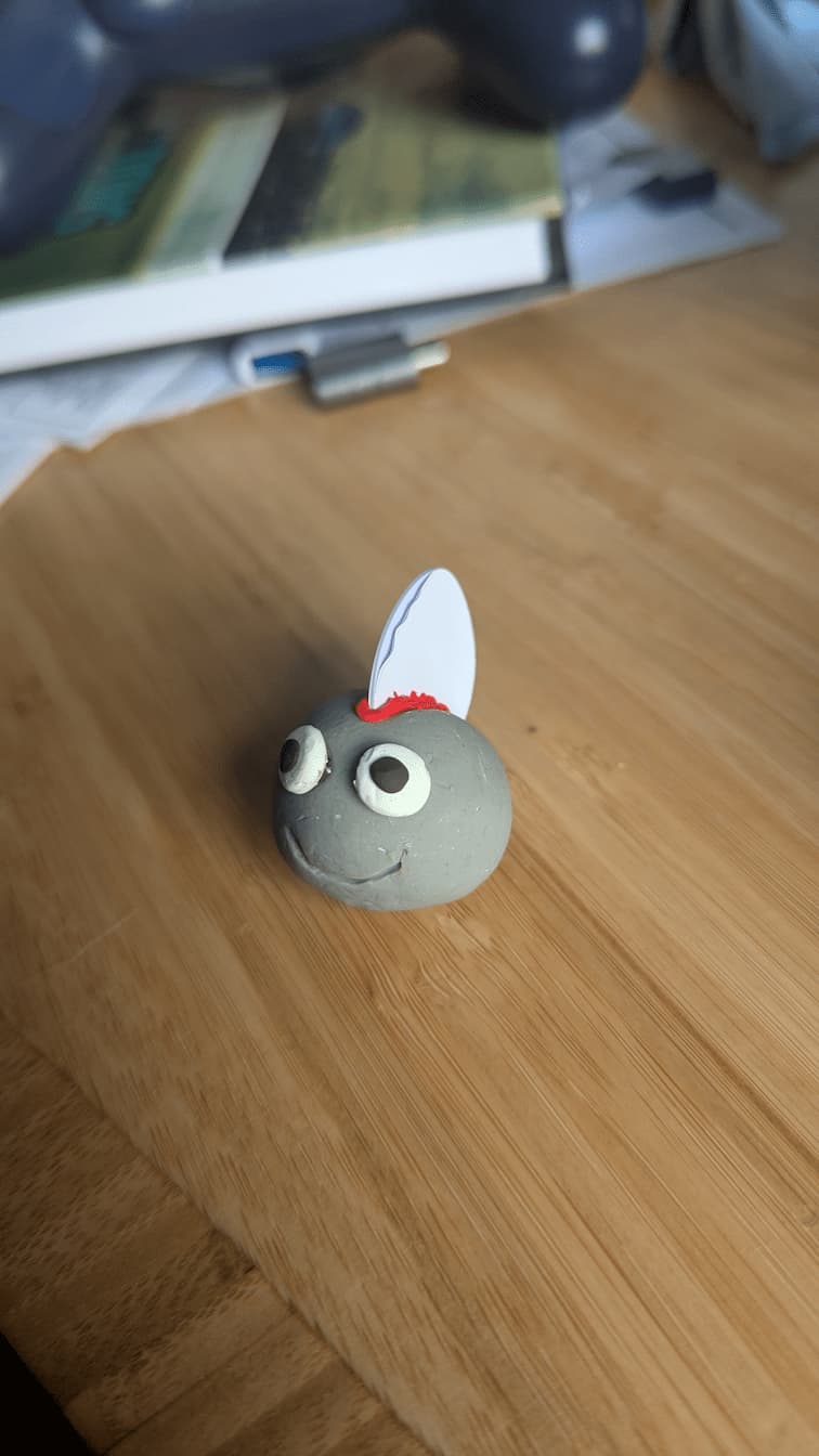 my NFC punk guy, a little sculpey blob with eyeballs and a bloody nfc chip lodged in his braaaaaain.